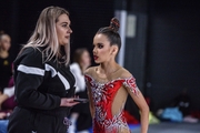 Academy coach Evgeniya Eliseeva gets Eva Chugunova ready for a performance