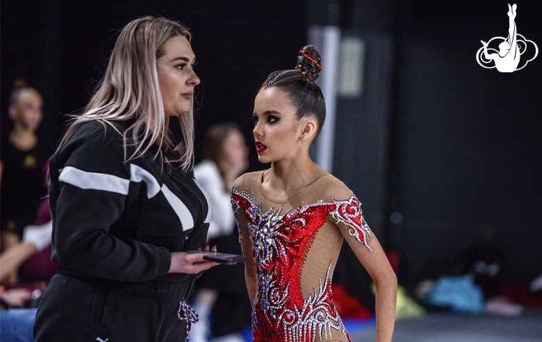 Academy coach Evgeniya Eliseeva gets Eva Chugunova ready for a performance