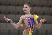 Gymnast during an exercise with clubs