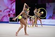 Group team gymnasts from Moscow during an exercise with balls and hoops