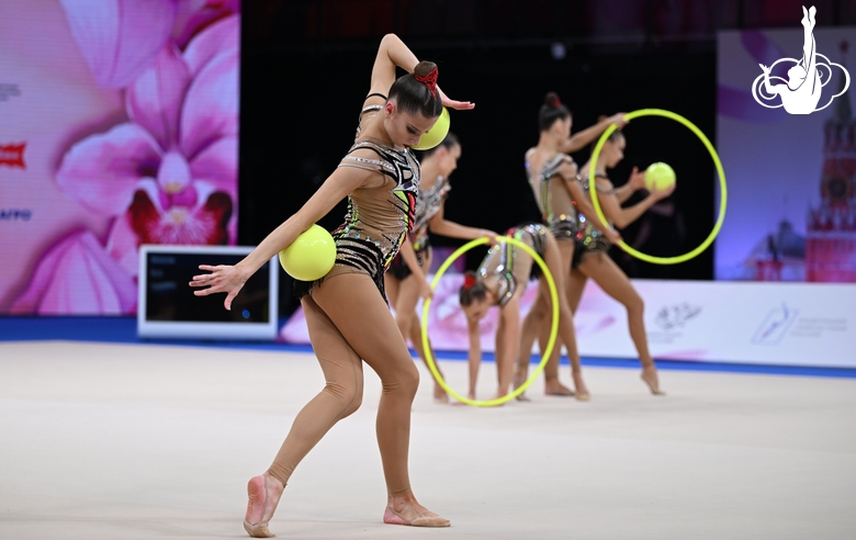 Group team gymnasts from Moscow during an exercise with balls and hoops