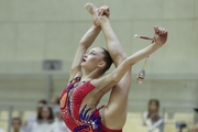 Gymnast during an exercise with clubs