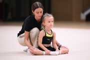 Academy coach Elizaveta Chernova with a young gymnast during the selection