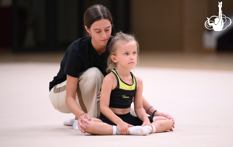 Academy coach Elizaveta Chernova with a young gymnast during the selection