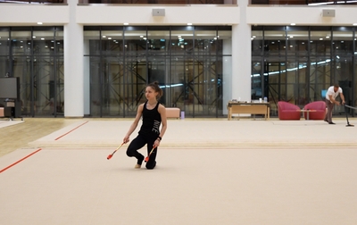 Olympic champion Alina Kabaeva helps Arina Kovshova refine her clubs routine