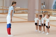 Academy coach Olga Frolova with young gymnasts during a lesson