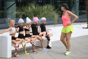 Academy coach Olesya Kovaleva and young gymnasts during training