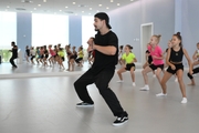 Choreographer Artur Nureev with gymnasts during practice at the training camp in the Academy