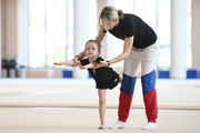 Academy Coach Olga Frolova with a young gymnast during the training session