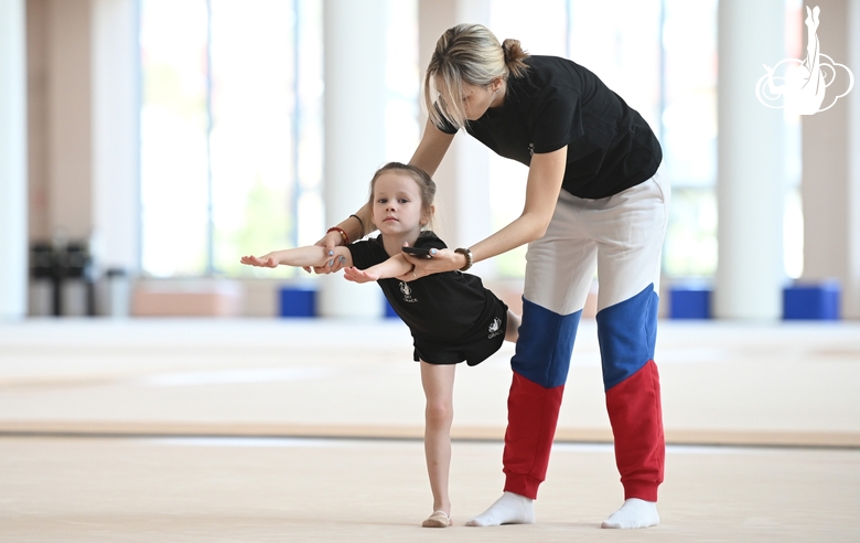 Academy Coach Olga Frolova with a young gymnast during the training session