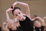 Young gymnast during the rehearsal of the competition opening ceremony.