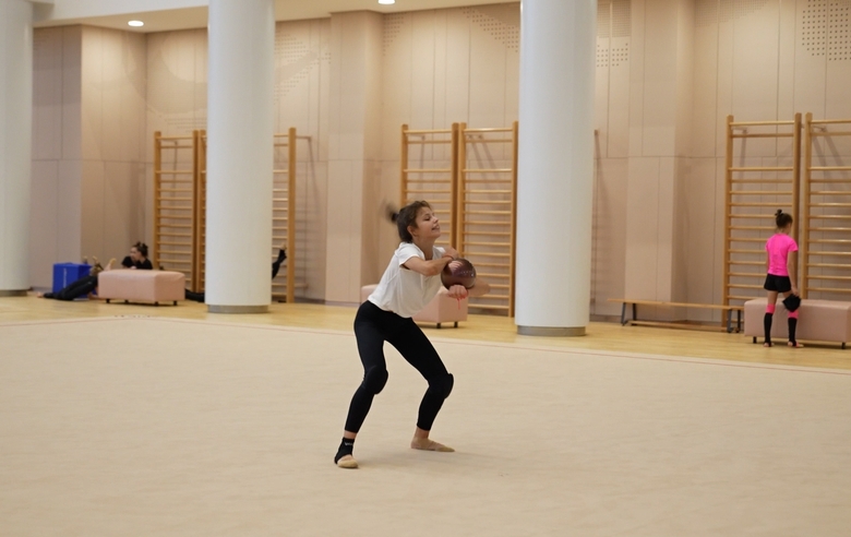 Karolina Tarasova practices the dance sequence with the Olympic champion