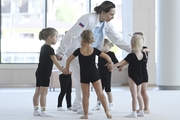 Academy coach Olesya Kovaleva with young gymnasts during training