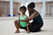 Gymnast from the Republic of Congo Nkenko Sita Davina Chanselvi together with coach Dominique Adama when stretching