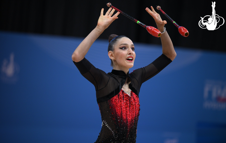 Nina Dragovic during an exercise with clubs