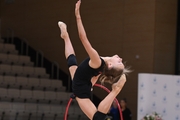 Gymnast during an exercise with a hoop during floor testing