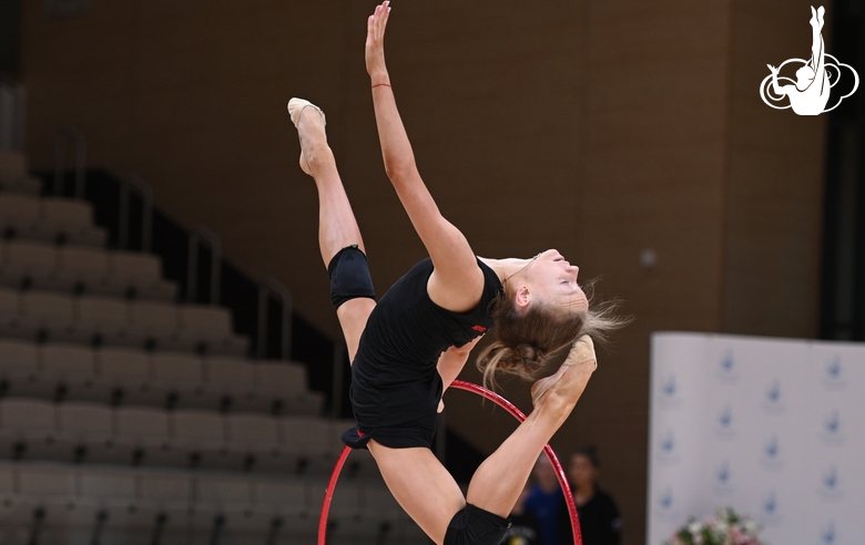 Gymnast during an exercise with a hoop during floor testing