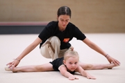 Academy coach Elizaveta Chernova with a young gymnast during the selection process