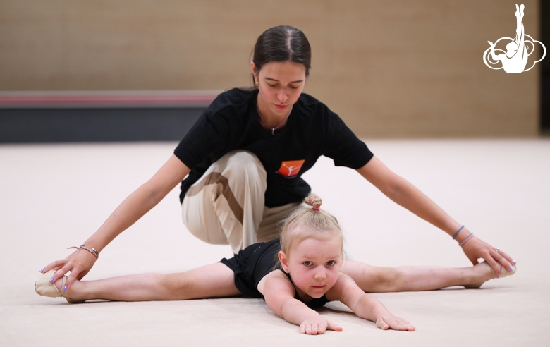 Academy coach Elizaveta Chernova with a young gymnast during the selection process