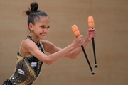 Valeria Medvedeva during an exercise with clubs  at a control training session