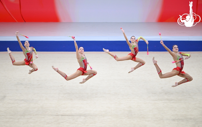 Group exercise gymnasts during the exercise with clubs