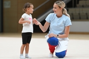 Academy Coach Anna Ustsova with a young gymnast during the selection