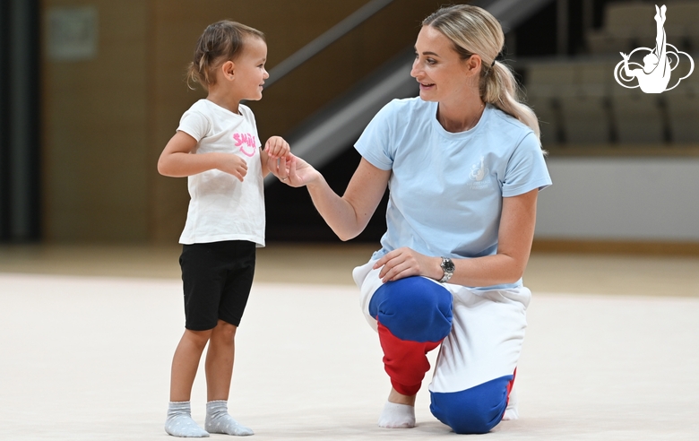 Academy Coach Anna Ustsova with a young gymnast during the selection