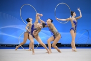 Team Uzbekistan during an exercise with hoops and clubs