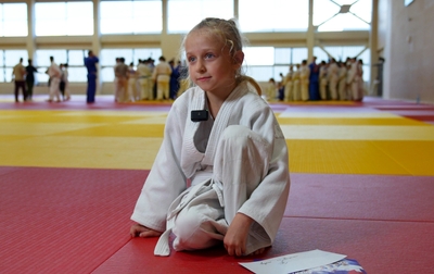 The five year old judoka with her mother at the master class of Olympics prizewinner Tamerlan Bashaev in the Martial Arts Academy