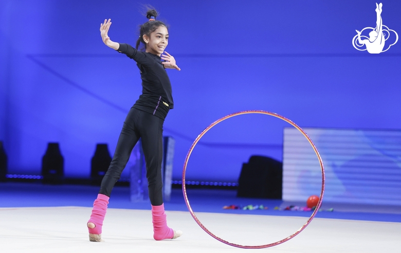 Lamia Tariq Malallah during an exercise with a hoop at floor testing