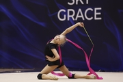 Gymnast during an exercise with a ribbon at floor testing