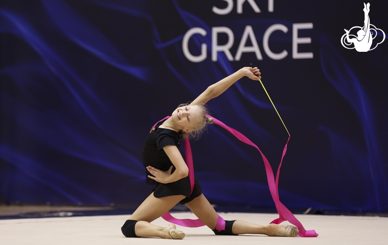 Gymnast during an exercise with a ribbon at floor testing