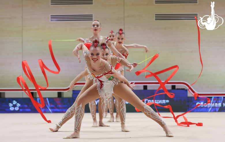 Gymnasts during an exercise with balls and ribbons