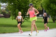 Academy coach Olesya Kovaleva and young gymnasts during training