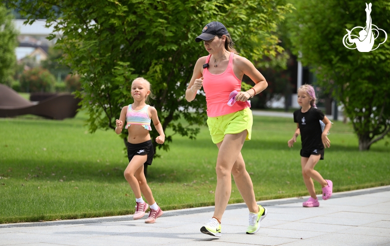 Academy coach Olesya Kovaleva and young gymnasts during training