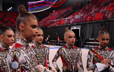 Olympic champion Alina Kabaeva sets up the Academy group gymnasts for the final performance with clubs