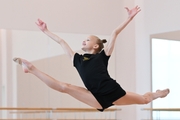 Kristina Voitenko performs a split jump during training