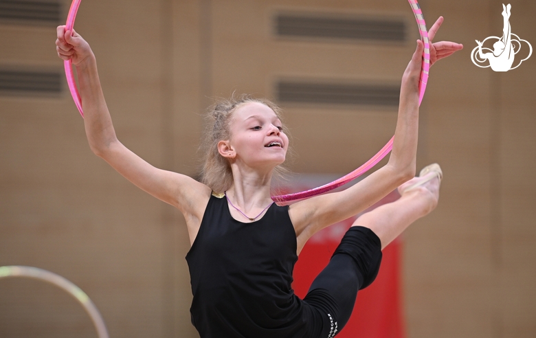 Gymnast during an exercise with a hoop during floor testing