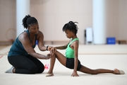 Gymnast from the Republic of Congo Nkenko Sita Davina Chanselvi together with coach Dominique Adama when stretching