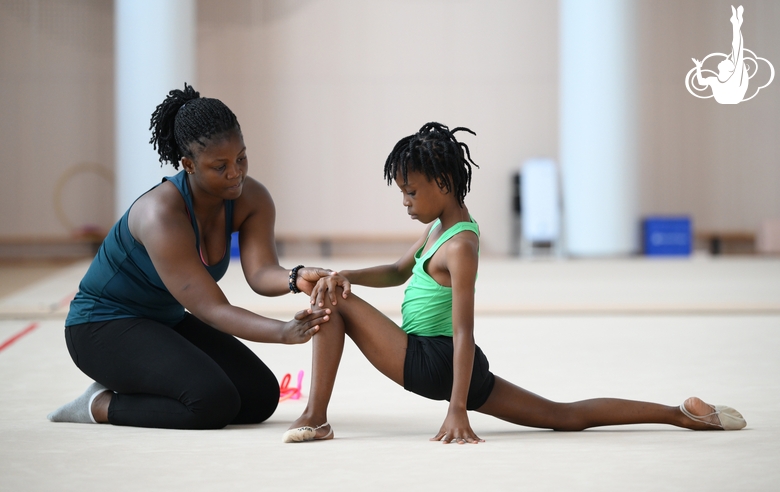 Gymnast from the Republic of Congo Nkenko Sita Davina Chanselvi together with coach Dominique Adama when stretching