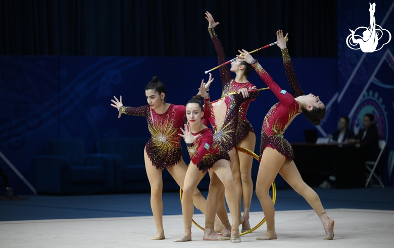 Team Uzbekistan during an exercise with hoops and clubs