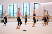 Gymnasts practice choreography during the recovery camp at the Academy