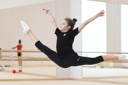 Karolina Tarasova performs a split jump during training