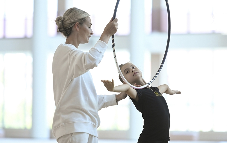 Academy coach Anna Ustsova works with Elvira Belyaeva