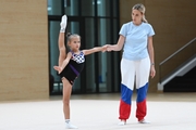 Academy Coach Anna Ustsova with a young gymnast during the selection