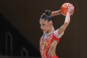 Gymnast does an exercise with a ball during an individual program performance