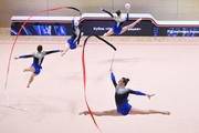 Gymnasts during an exercise with balls and ribbons