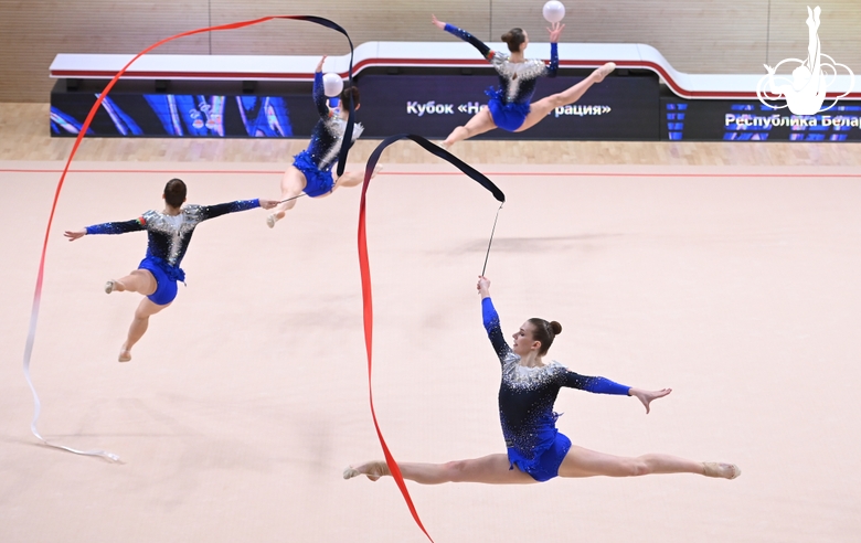 Gymnasts during an exercise with balls and ribbons