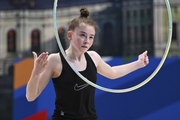 Gymnasts perform exercises with hoops during floor testing before the BRICS Games