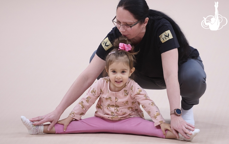 Academy Coach Alla Mishenina with a young gymnast during the selection